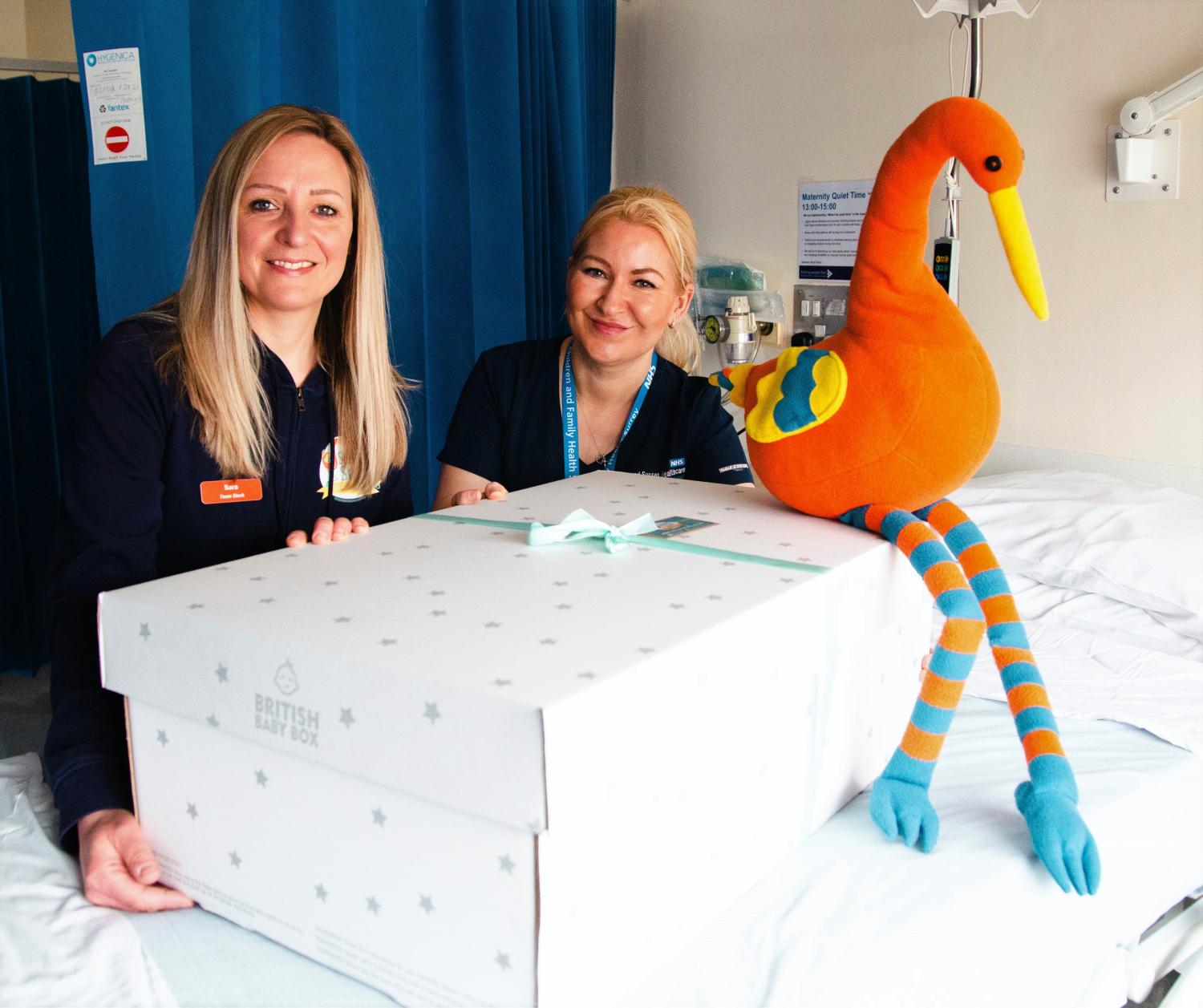Mary Clare Chapman (right) receives Baby Box from Stripey Stork’s Operations Manager, Sara Beadle (left) at East Surrey Hospital